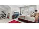 A bright bedroom with carpet floors, a double bed, and a cozy workspace at 117 Via Roma, Woodstock, GA 30188