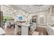 Open-concept living space featuring a gourmet kitchen flowing into a comfortable living area with fireplace at 117 Via Roma, Woodstock, GA 30188