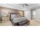 Spacious main bedroom featuring a tray ceiling and elegant furnishings at 117 Via Roma, Woodstock, GA 30188
