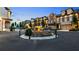 Charming townhome community featuring a beautiful fountain and well-maintained landscaping for an inviting curb appeal at 117 Via Roma, Woodstock, GA 30188