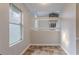 Cozy dining area with tile floors and railing that looks over the living room at 8670 Brandon Hill Ln, Jonesboro, GA 30238