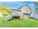 View of home's exterior showing the deck and well maintained grassy yard at 8670 Brandon Hill Ln, Jonesboro, GA 30238