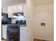 Practical kitchen layout featuring sleek black appliances, plus a separate utility area at 8670 Brandon Hill Ln, Jonesboro, GA 30238