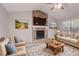 Inviting living room features stone fireplace, vaulted ceiling, and neutral decor at 8670 Brandon Hill Ln, Jonesboro, GA 30238