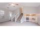 Welcoming living room with staircase and railing offering views to another room at 8670 Brandon Hill Ln, Jonesboro, GA 30238
