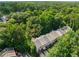 Aerial view of townhomes nestled in a lush, green neighborhood with mature trees at 106 Oakhurst Ter, Decatur, GA 30030