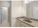 This bathroom features a single sink vanity with a granite countertop, a shower with a patterned curtain at 106 Oakhurst Ter, Decatur, GA 30030