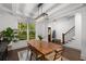 Bright dining room with large windows, modern light fixture, and hardwood floors at 106 Oakhurst Ter, Decatur, GA 30030