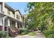 Charming two-story townhome with a well-maintained lawn, brick accents, and a wooden porch at 106 Oakhurst Ter, Decatur, GA 30030