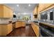 Modern kitchen with stainless steel appliances, granite countertops and hardwood floors at 106 Oakhurst Ter, Decatur, GA 30030