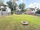 Large backyard featuring a fire pit, well maintained lawn and room for gardening at 1872 Canmont Ne Dr, Brookhaven, GA 30319