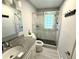 Modern bathroom with granite countertop vanity, glass-enclosed shower with tiled surround, and updated fixtures at 1872 Canmont Ne Dr, Brookhaven, GA 30319