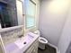 This bathroom features a modern vanity, sink, and toilet with updated hardware and fixtures at 1872 Canmont Ne Dr, Brookhaven, GA 30319
