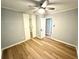 This bedroom features updated laminate flooring, light gray walls and a closet with mirrored doors at 1872 Canmont Ne Dr, Brookhaven, GA 30319