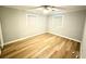 Bedroom showing neutral walls, flooring, ceiling fan and modern double hung windows at 1872 Canmont Ne Dr, Brookhaven, GA 30319