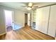 This bedroom offers updated laminate flooring, closet and access to an attached bathroom at 1872 Canmont Ne Dr, Brookhaven, GA 30319