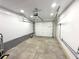 Spacious garage with white walls, concrete floor, and ample room for parking and storage at 1872 Canmont Ne Dr, Brookhaven, GA 30319
