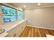 Bright nook with built-in cabinets, large windows, modern flooring and light gray walls at 1872 Canmont Ne Dr, Brookhaven, GA 30319