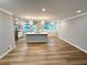Bright living room featuring an open floor plan, recessed lighting, and stylish light fixtures over island at 1872 Canmont Ne Dr, Brookhaven, GA 30319