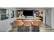 An entertainment space with built-in bar, stools, media, and plenty of light at 220 Gamble Dr, Carrollton, GA 30116