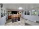 An entertainment space with built-in bar, stools, media, and plenty of light at 220 Gamble Dr, Carrollton, GA 30116