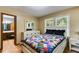 Charming bedroom with natural light, wood floors, and an en suite bathroom at 220 Gamble Dr, Carrollton, GA 30116