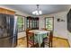 Cozy dining area featuring hardwood floors, a chandelier, and a vintage china cabinet at 220 Gamble Dr, Carrollton, GA 30116