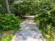 Private driveway surrounded by lush greenery offering seclusion and natural beauty at 220 Gamble Dr, Carrollton, GA 30116