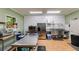 The commercial kitchen features stainless steel counters, a double sink and a large refrigerator at 220 Gamble Dr, Carrollton, GA 30116