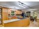 Charming kitchen with wood floors, an island, and modern appliances at 220 Gamble Dr, Carrollton, GA 30116
