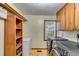 Functional laundry room featuring modern washer/dryer and ample storage at 220 Gamble Dr, Carrollton, GA 30116