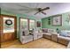 Inviting living room with warm wood floors and cozy seating area, featuring a decorative front door at 220 Gamble Dr, Carrollton, GA 30116