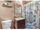 Stylish bathroom featuring modern vanity, decorative shower curtain and shelves with decor at 2532 Millbrook Dr, Snellville, GA 30078