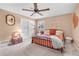 Cozy bedroom with natural light, ceiling fan, and spacious closet at 2532 Millbrook Dr, Snellville, GA 30078