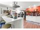 Bright kitchen with stainless steel appliances, white cabinets, and spacious breakfast bar with seating at 2532 Millbrook Dr, Snellville, GA 30078