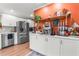 Modern kitchen featuring stainless steel appliances, white cabinetry, and a coffee bar at 2532 Millbrook Dr, Snellville, GA 30078