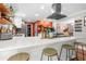 Bright kitchen with stainless steel appliances, white cabinets, and spacious breakfast bar with seating at 2532 Millbrook Dr, Snellville, GA 30078