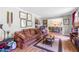 Cozy living room with comfortable seating, warm wood floors, and inviting decor at 2532 Millbrook Dr, Snellville, GA 30078