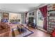 Bright living room featuring hardwood floors, large windows, and neutral color palette at 2532 Millbrook Dr, Snellville, GA 30078