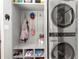Mudroom area, featuring convenient storage, shoe rack and modern washer and dryer at 2532 Millbrook Dr, Snellville, GA 30078