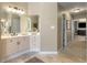 Bright bathroom featuring dual sinks, ample counter space and a large mirror at 290 Edwardton Ct, Roswell, GA 30076