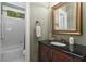 Charming bathroom with granite counters, classic fixtures, and a shower/tub combo at 290 Edwardton Ct, Roswell, GA 30076