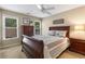Comfortable bedroom with natural light, ceiling fan, and neutral decor at 290 Edwardton Ct, Roswell, GA 30076