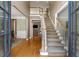 Open foyer with hardwood floors, staircase, and views into adjoining rooms, creating a grand entrance at 290 Edwardton Ct, Roswell, GA 30076