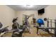 Home gym with workout equipment, mirrors, and space for fitness activities at 290 Edwardton Ct, Roswell, GA 30076