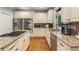 Well-equipped kitchen with stainless steel appliances, granite counters, and ample cabinet space at 290 Edwardton Ct, Roswell, GA 30076