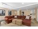 Cozy living room features a large sectional, neutral walls, recessed lights, and a convenient wet bar area at 290 Edwardton Ct, Roswell, GA 30076
