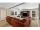 Cozy living room with a large sectional sofa, entertainment center, and natural light at 290 Edwardton Ct, Roswell, GA 30076