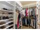 Spacious walk-in closet with custom shelving and hanging racks for organized storage at 290 Edwardton Ct, Roswell, GA 30076
