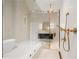 Stunning bathroom featuring gold fixtures, a glass shower, and a modern vanity for a luxurious spa-like experience at 4435 Pemberton Cv, Johns Creek, GA 30022